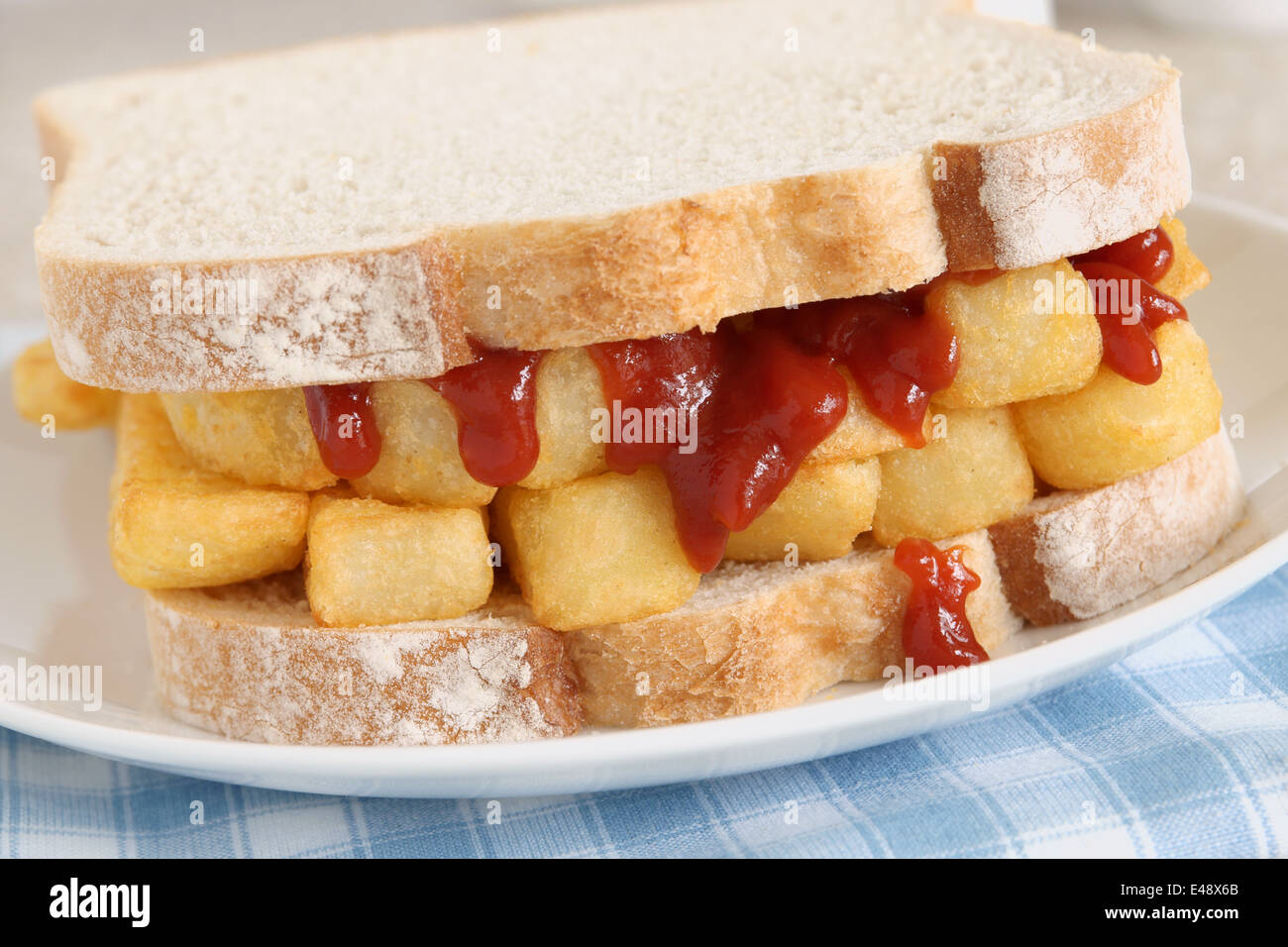 Chip Butty potato chips or fries in a sandwich Stock Photo