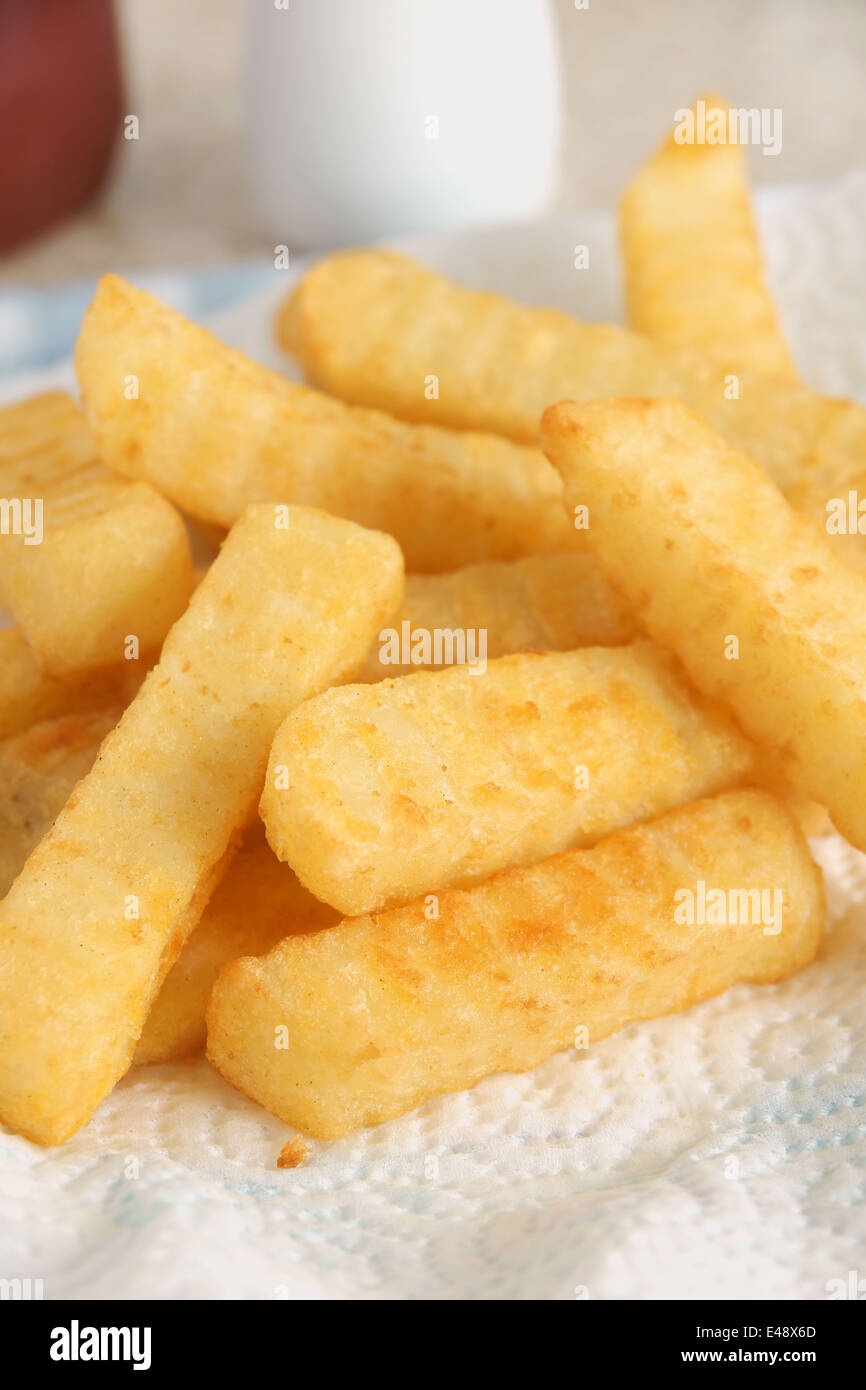 Freshly cooked crinkle cut chips or French fries Stock Photo