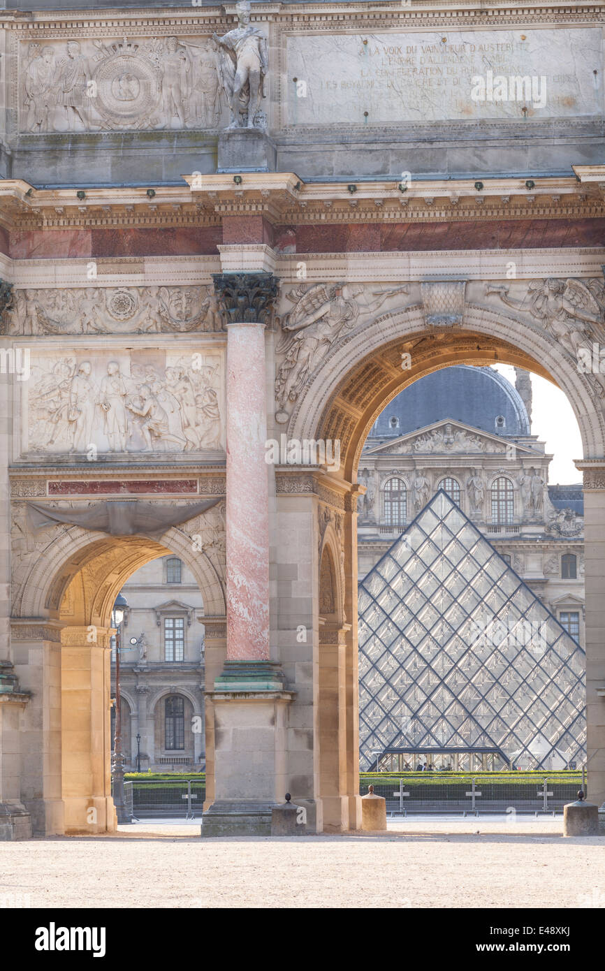 Arc de Triomphe du Carrousel, Paris. In the background is the Louvre Museum with the pyramid designed by Ieoh Ming Pei. Stock Photo