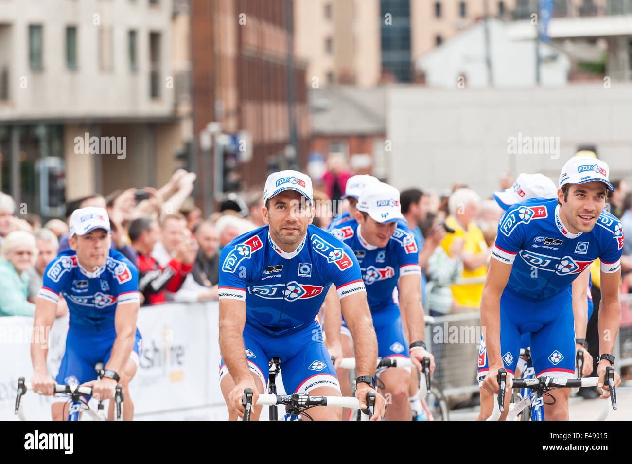 Cycle riders from the FDJ.FR team in the Tour de France parade through Millennium Square in Leeds. West Yorkshire Stock Photo