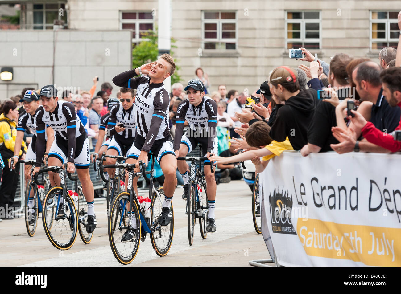 Marcel Kittel riding through Millennium Square in Leeds as the Shimano riders make their way to the opening ceremony. Stock Photo