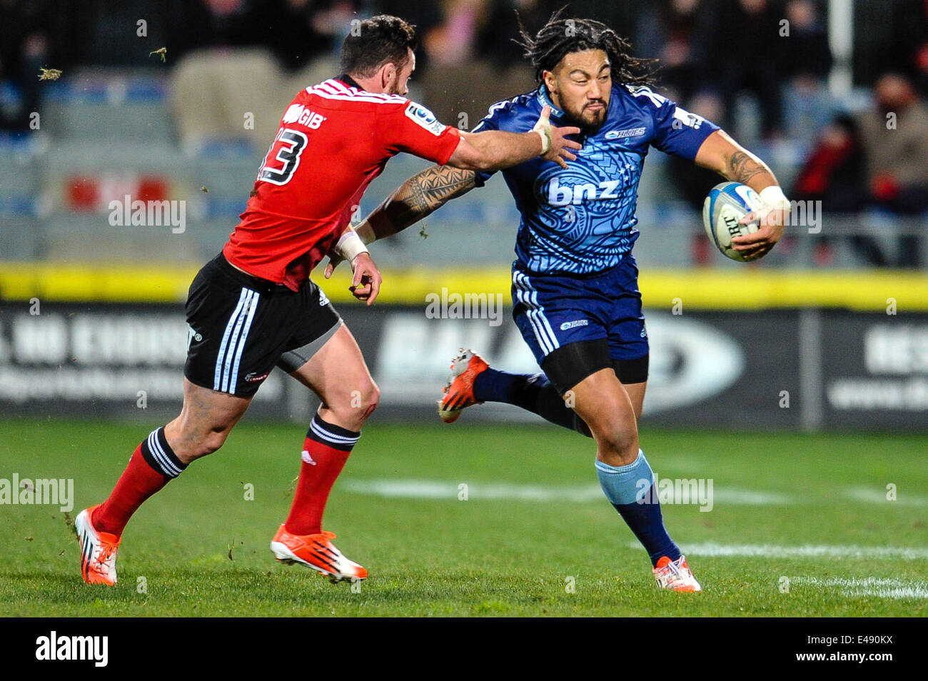 Christchurch, New Zealand. 05th July, 2014. Ma'a Nonu of the Blues is tackled by Ryan Crotty of the Crusaders in the Super rugby match, Crusaders versus The Blues, at AMI Stadium, Christchurch Credit:  Action Plus Sports/Alamy Live News Stock Photo