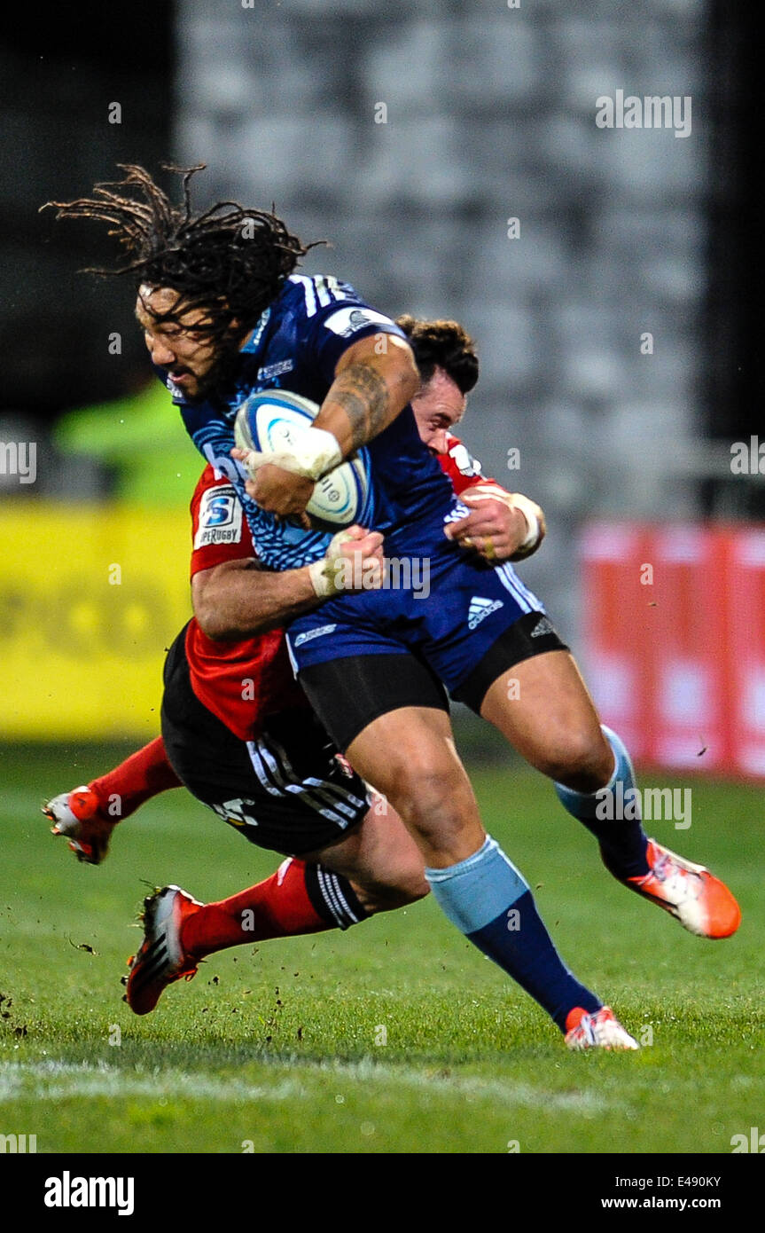 Christchurch, New Zealand. 05th July, 2014. Ma'a Nonu of the Blues is tackled by Ryan Crotty of the Crusaders in the Super rugby match, Crusaders versus The Blues, at AMI Stadium, Christchurch Credit:  Action Plus Sports/Alamy Live News Stock Photo