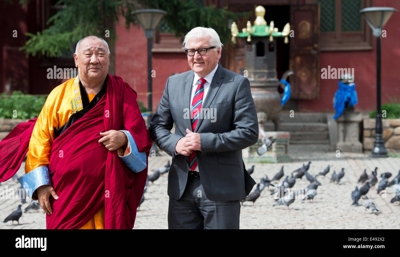 Ulan Bator, Mongolia. 06th July, 2014. German Foreign Minister Frank-Walter Steinmeier (SPD, R) and the abbot Demberel Choijamts visit the Gandantegchenling monastery in Ulan Bator, Mongolia, 06 July 2014. The monastery, founded in 1838 is one of the most important site of the Lamaist Buddhism. Steinmeier visits Mongolia for two days. Photo: Soeren Stache/dpa/Alamy Live News Stock Photo