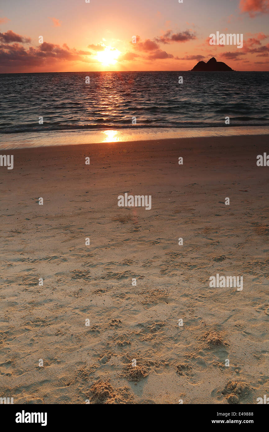 Sunrise along the beautiful Lanikai white sand beach on the island of Oahu, Hawai'i Stock Photo