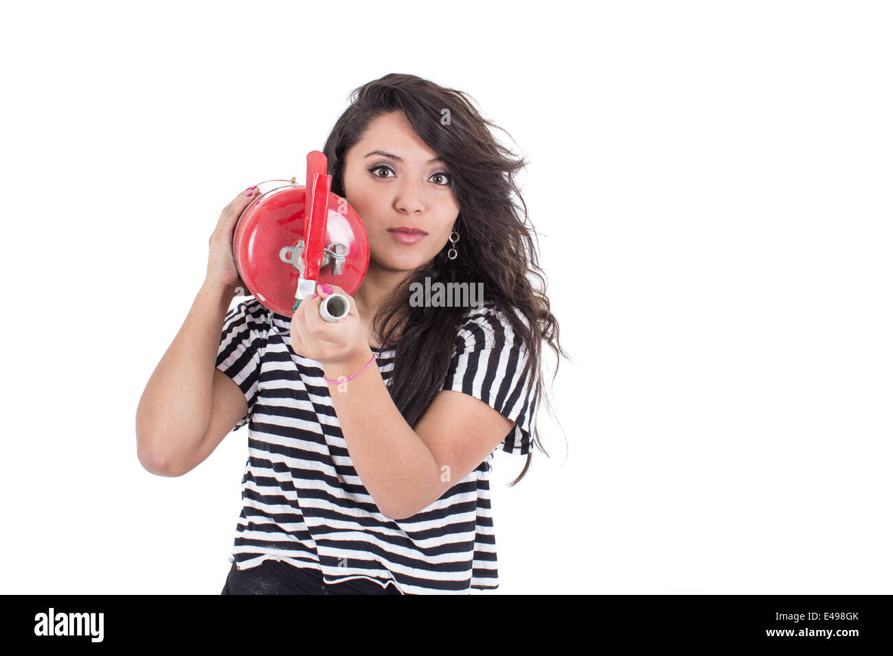 latin girl holding fire extinguisher Stock Photo