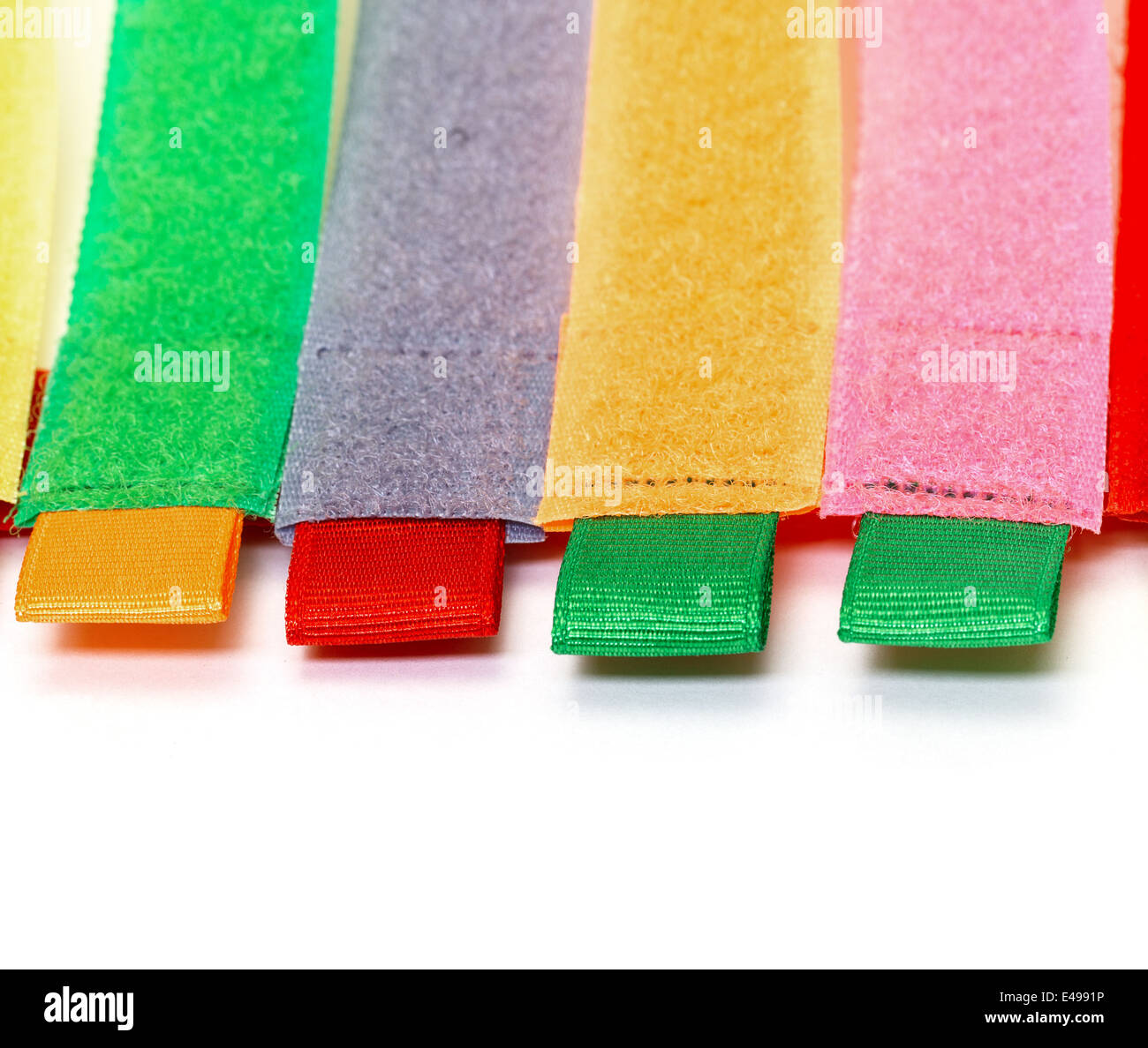 Pack of Colorful Velcro Strips, on white background Stock Photo