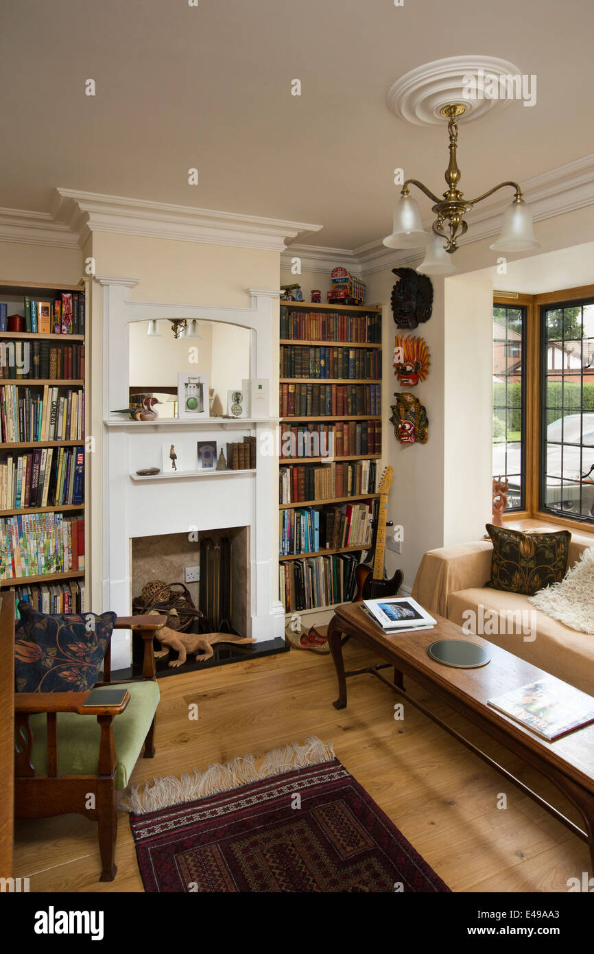 house interiors, small snug with bookshelves, of self-built house designed on arts and crafts design principles Stock Photo