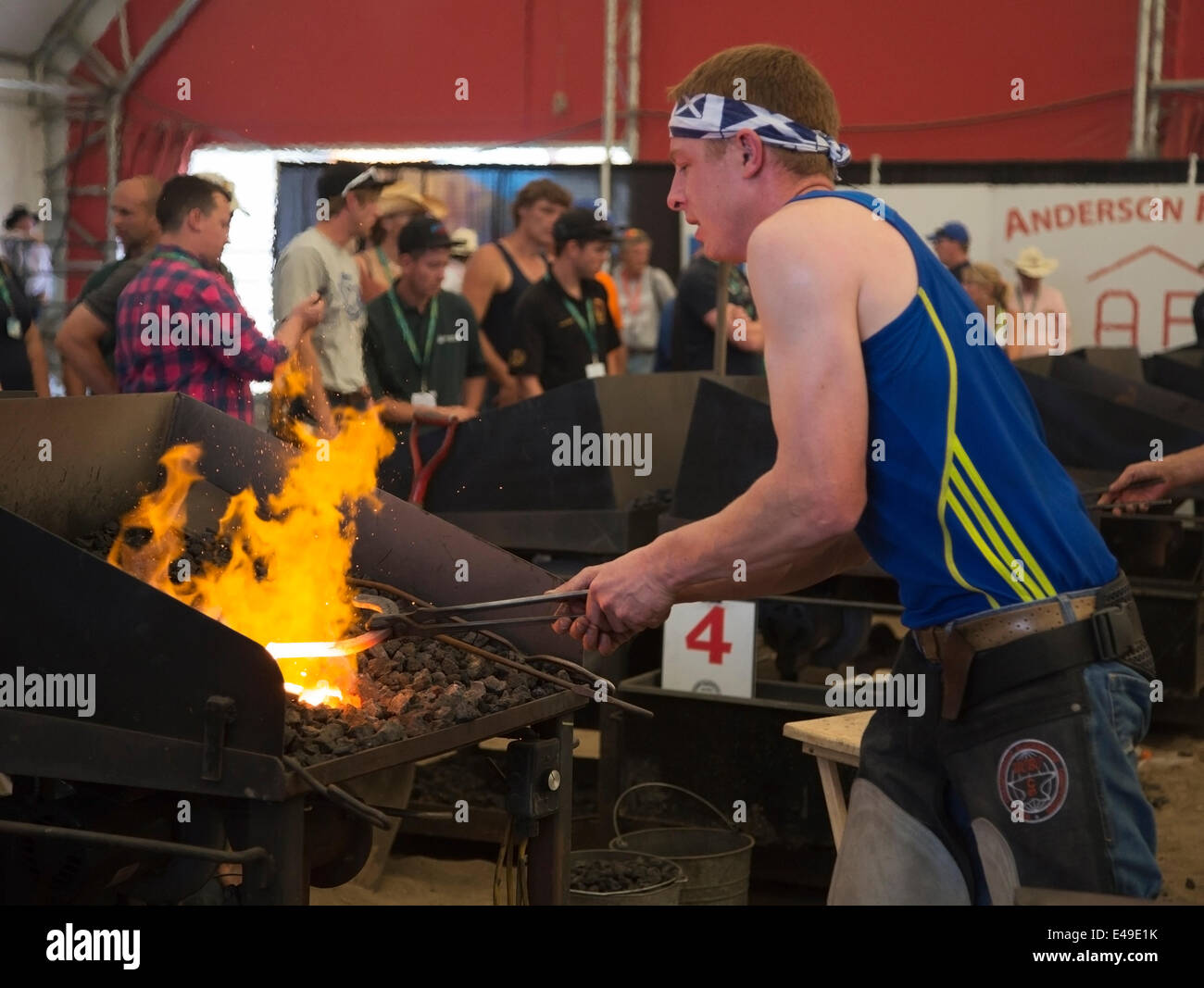 Calgary, Alberta, Canada. 06th July, 2014. Farrier forgeing horseshoe as he competes in the final round of the World Championships Blacksmiths' competition at the Calgary Stampede on Sunday, July 6, 2014. The top five farriers are competing for the title of world champion in this longstanding tradition at the Stampede. Calgary, Alberta, Canada. Credit:  Rosanne Tackaberry/Alamy Live News Stock Photo