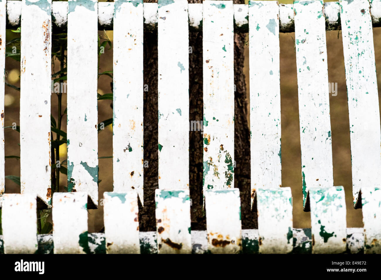Old rusty stripped metal bench at the side of a channel in Xochimilco