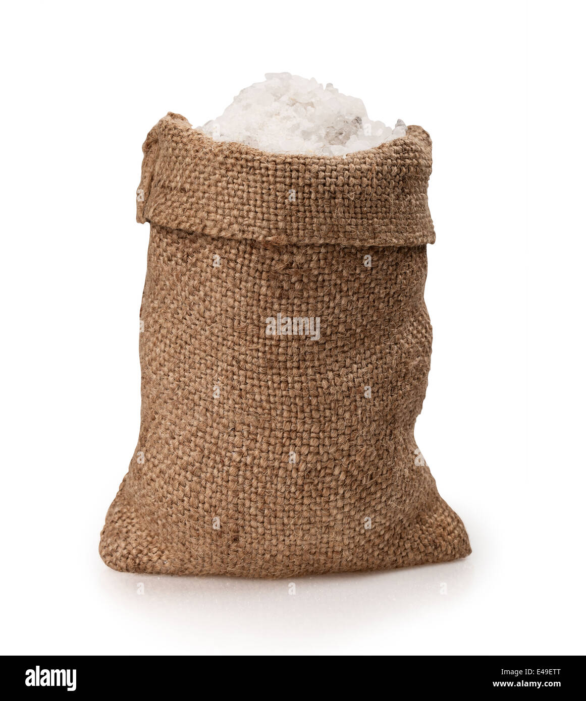 Sea salt in a jute sack on a white background. Clipping Path Stock Photo