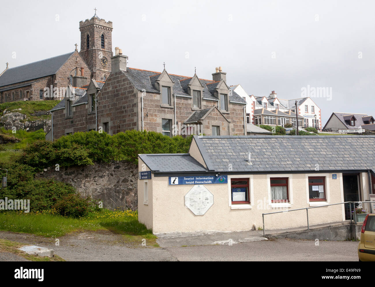Tourist Information Office church and village houses of Castlebay, Isle of Barra, Outer Hebrides, Scotland Stock Photo
