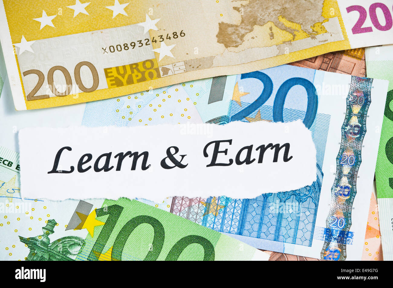 Learn and earn concept and euro notes Stock Photo - Alamy