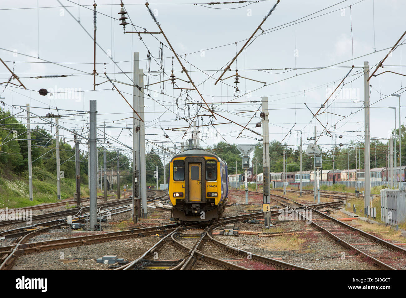 Diesel Multiple Unit (DMU) Class 156 operated by Northern Rail approaching Carnforth Station, Lancashire Stock Photo