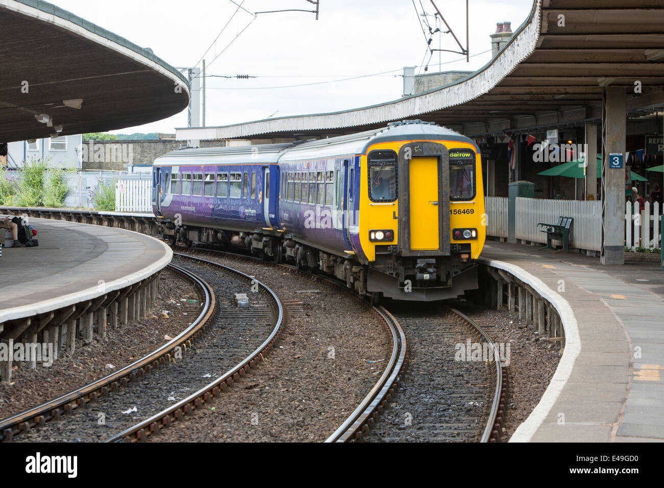 Diesel Multiple Unit (DMU) Class 156 operated by Northern Rail entering Carnforth Station, Lancashire Stock Photo