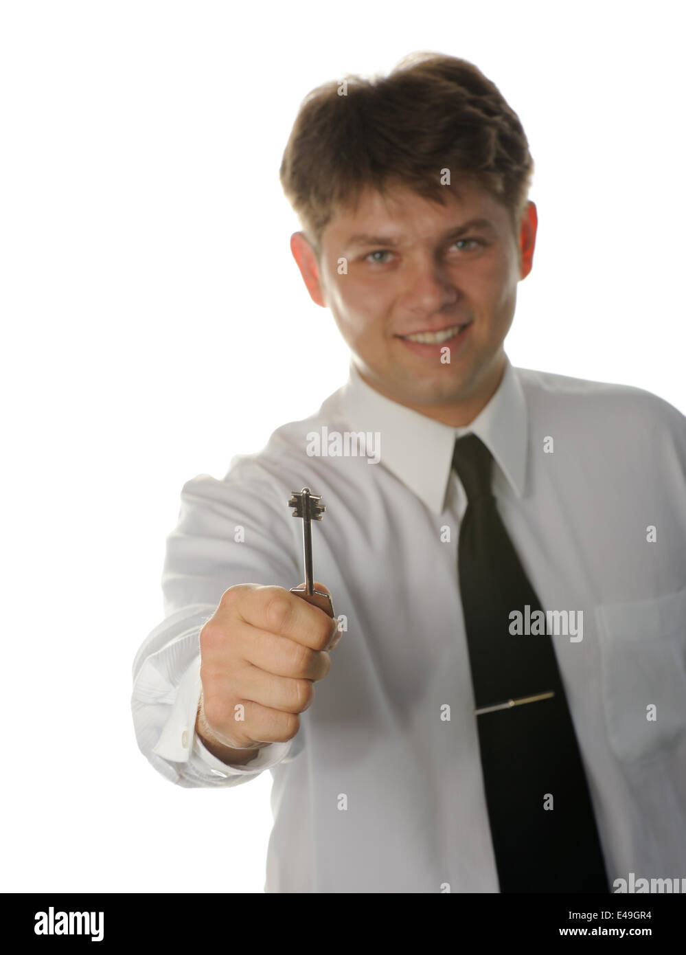 The young businessman with a key in a hand Stock Photo - Alamy
