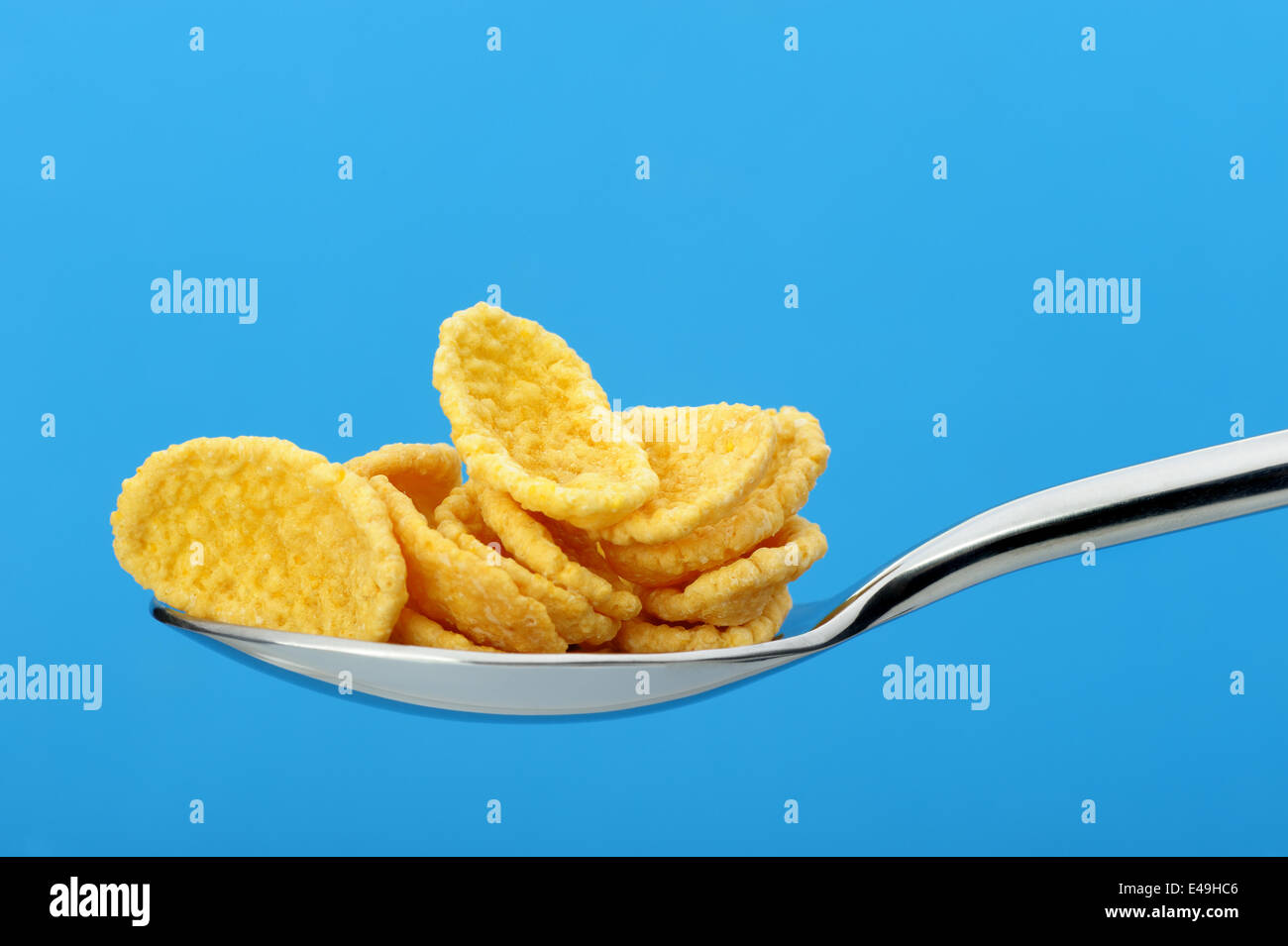 Сornflakes. A dry breakfast in a spoon. Stock Photo