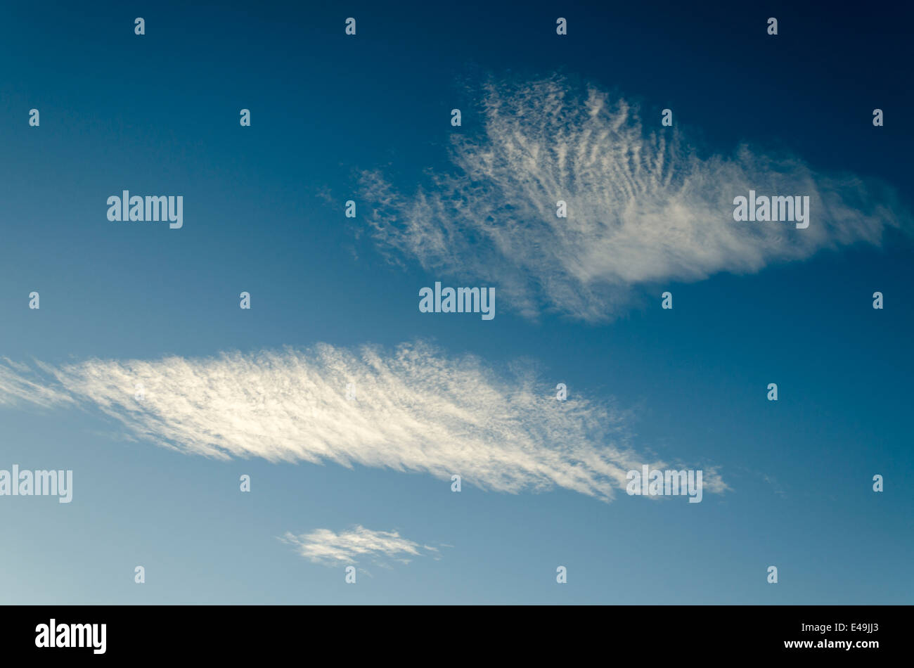 Clouds in a beautiful blue sky Stock Photo - Alamy