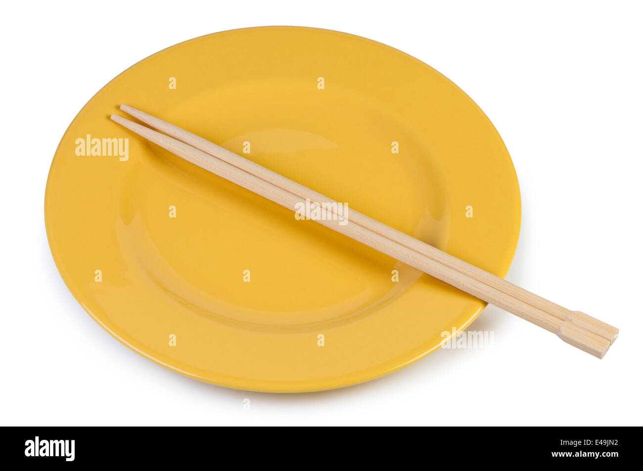 Yellow plate with chopsticks Stock Photo