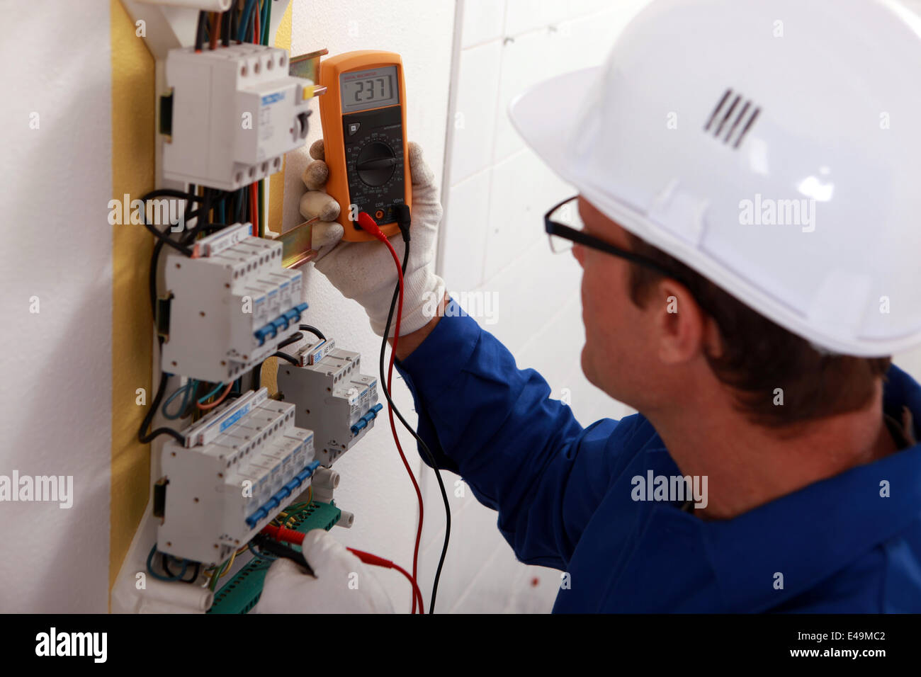 Electrical inspector reading power output Stock Photo