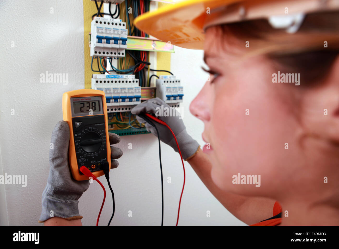 An electrician using a multimeter Stock Photo