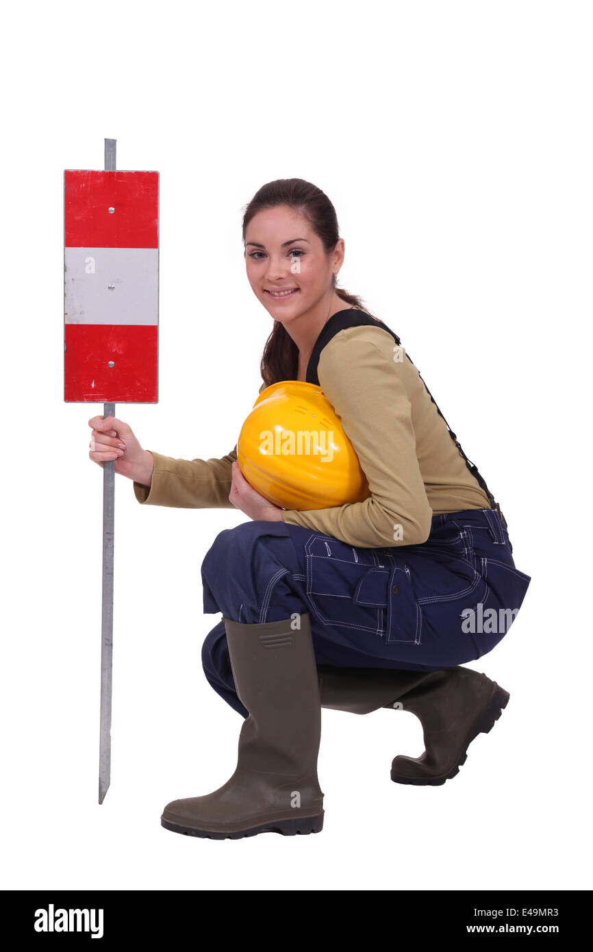 Construction work with a warning sign Stock Photo - Alamy