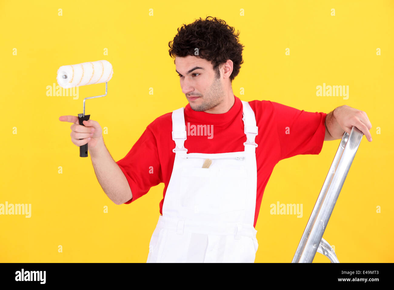 Man with paint roller and ladder Stock Photo Alamy