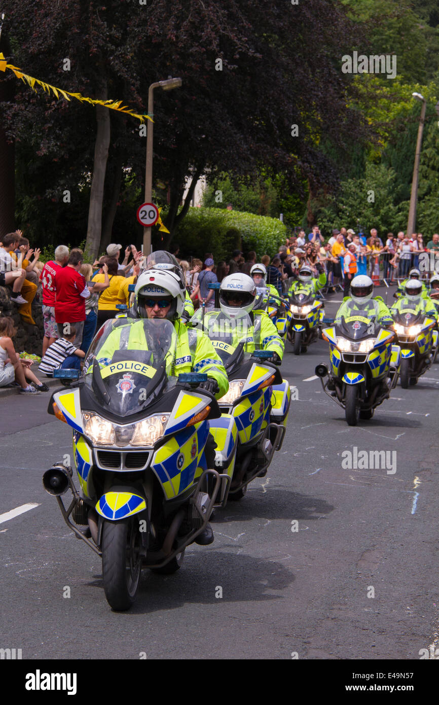 Greetland, UK. 6th July, 2014. The police drive by with Crowd of people wainting for the cyclists on Hullen edge lane during the stage 2 of Le Tour de France on July 06 2014 in Greetland, England. Credit:  christopher smith/Alamy Live News Stock Photo