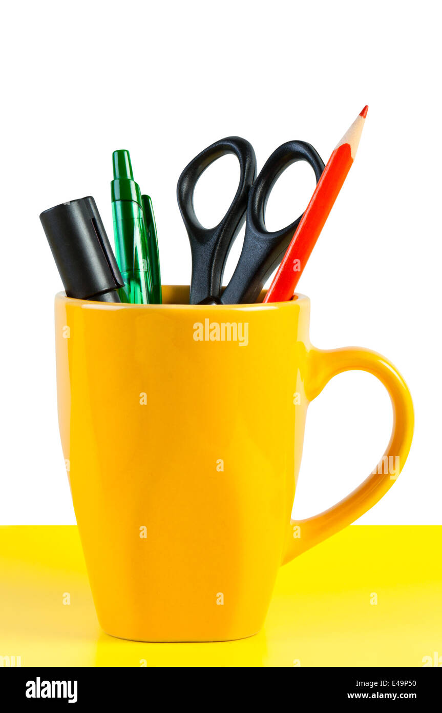 Stationary appliances in a cup. Stock Photo