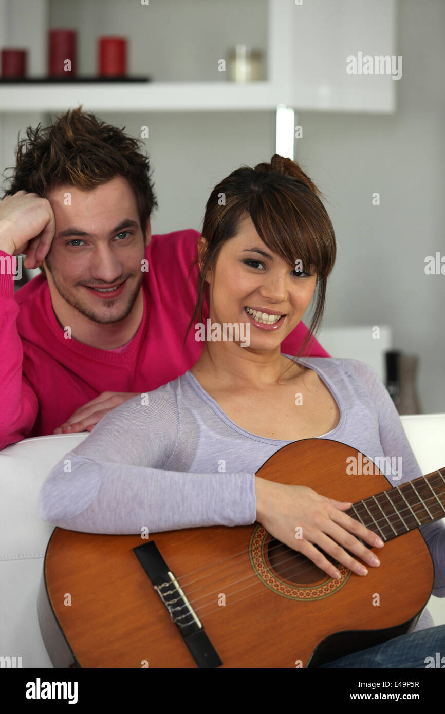 a young couple relaxing in a lounge Stock Photo