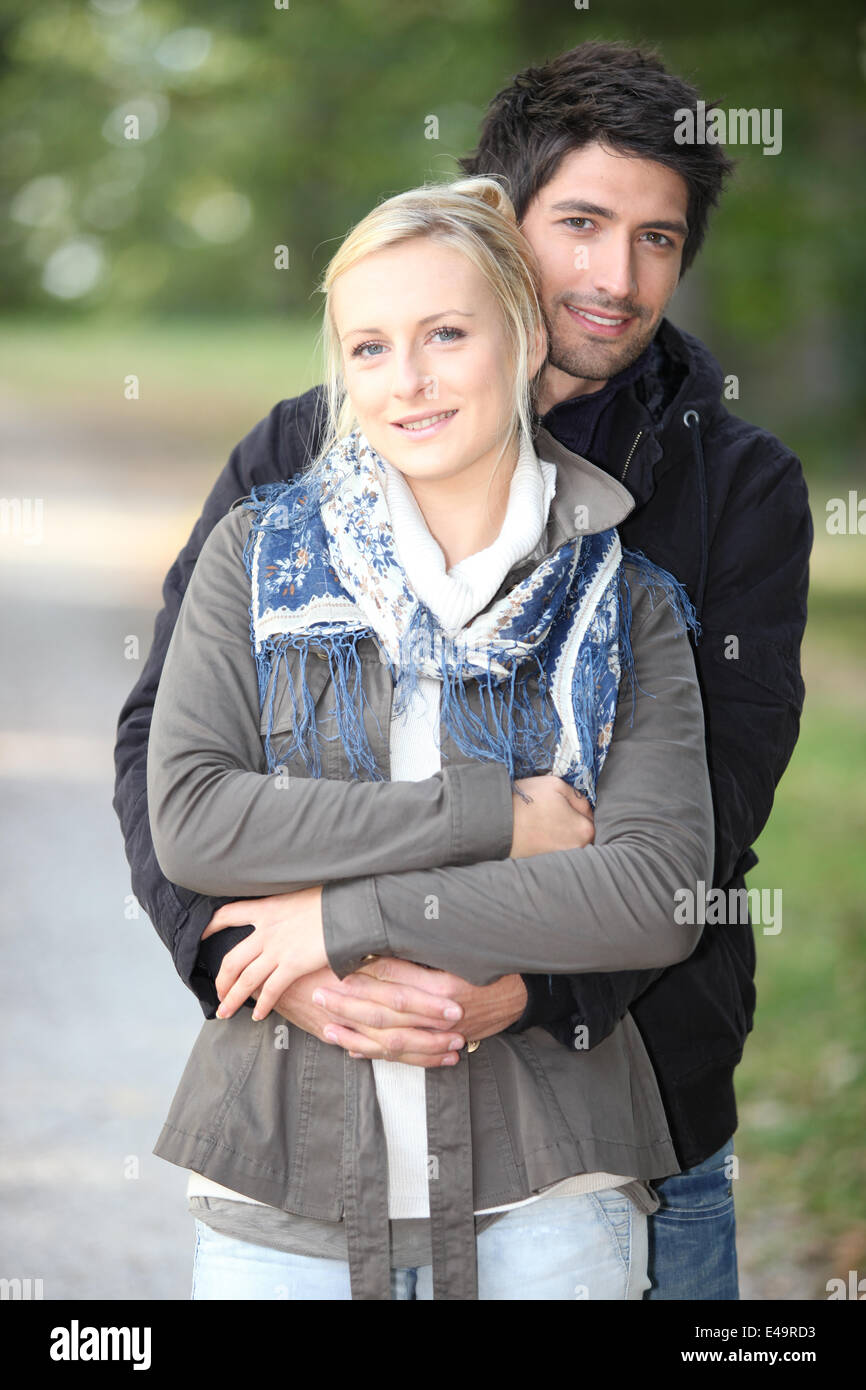Couple enjoying walk in park Stock Photo - Alamy