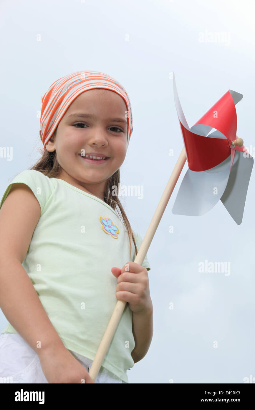 Girl holding a windmill Stock Photo - Alamy