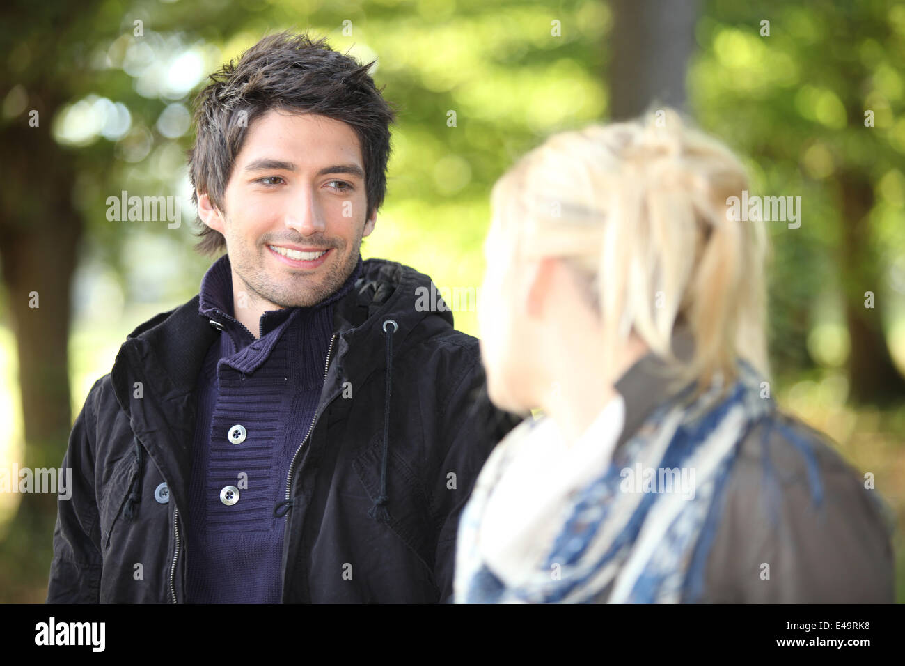 young couple walking in the park Stock Photo - Alamy