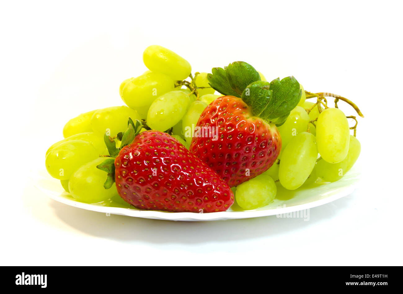 Grapes with strawberry Stock Photo Alamy
