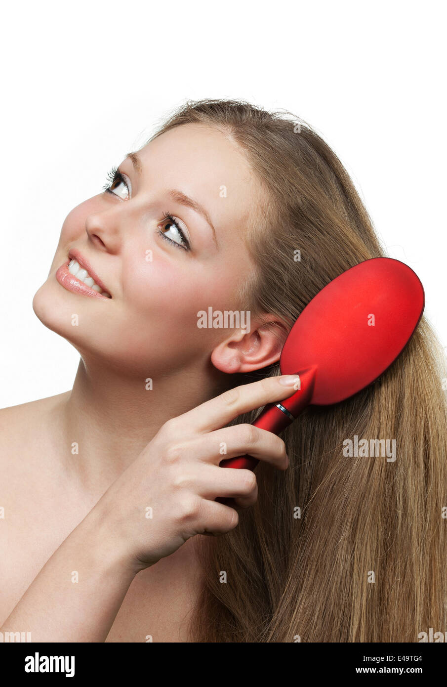 The girl with long hair and a hairbrush Stock Photo - Alamy