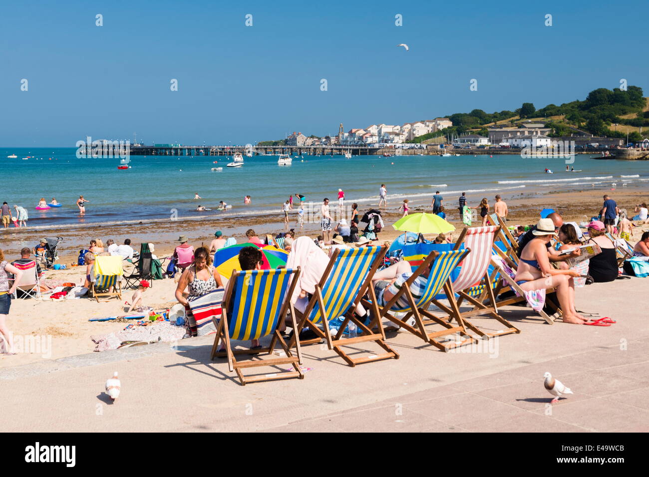 Colourful deck chairs at Swanage Beach, Dorset, England, United Kingdom, Europe Stock Photo