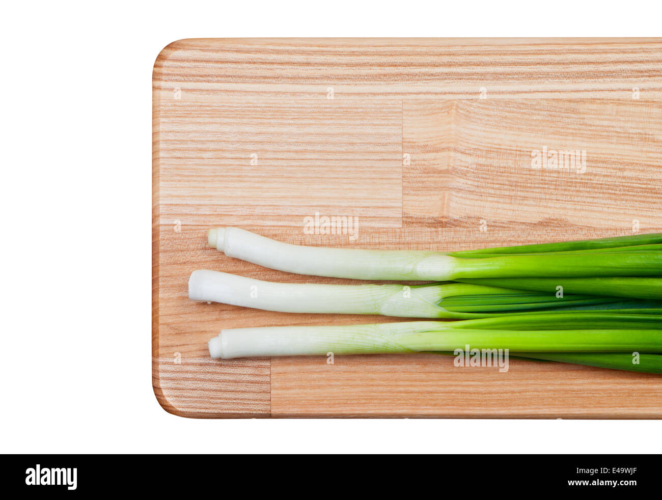 Green onions on cutting board. Stock Photo