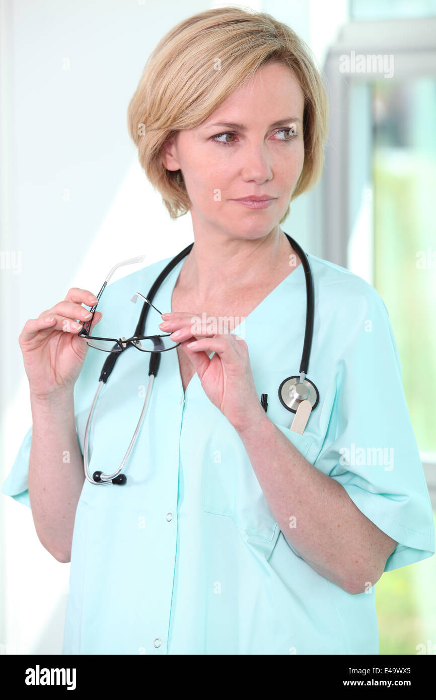 Nurse holding glasses Stock Photo Alamy