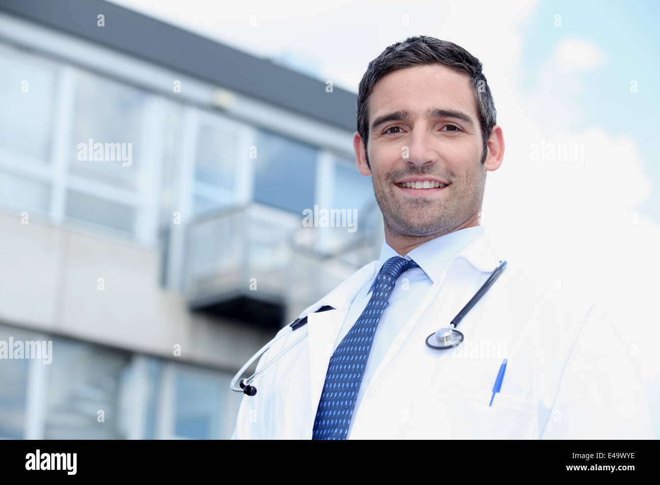 Doctor stood outside hospital Stock Photo