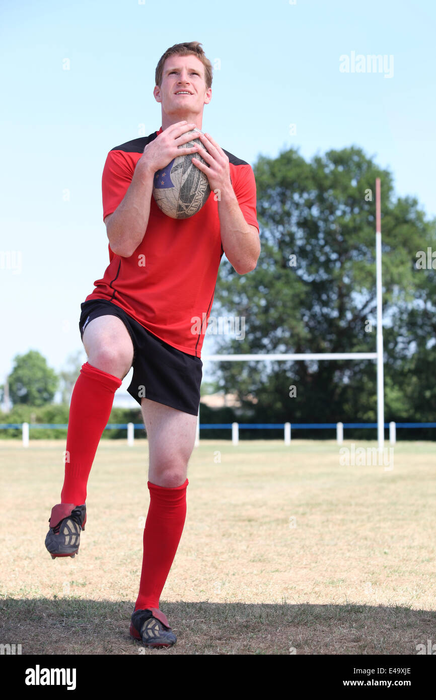 Man playing rugby Stock Photo