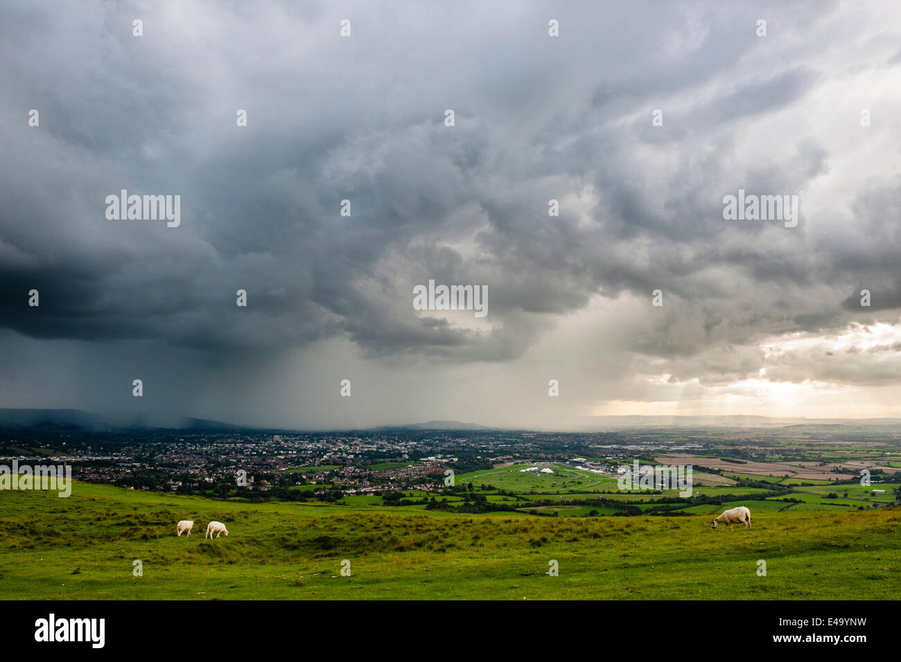 Looking out from Cleve Hill as a storm crosses the Severn Vale, Cheltenham, Gloucestershire, England, United Kingdom, Europe Stock Photo