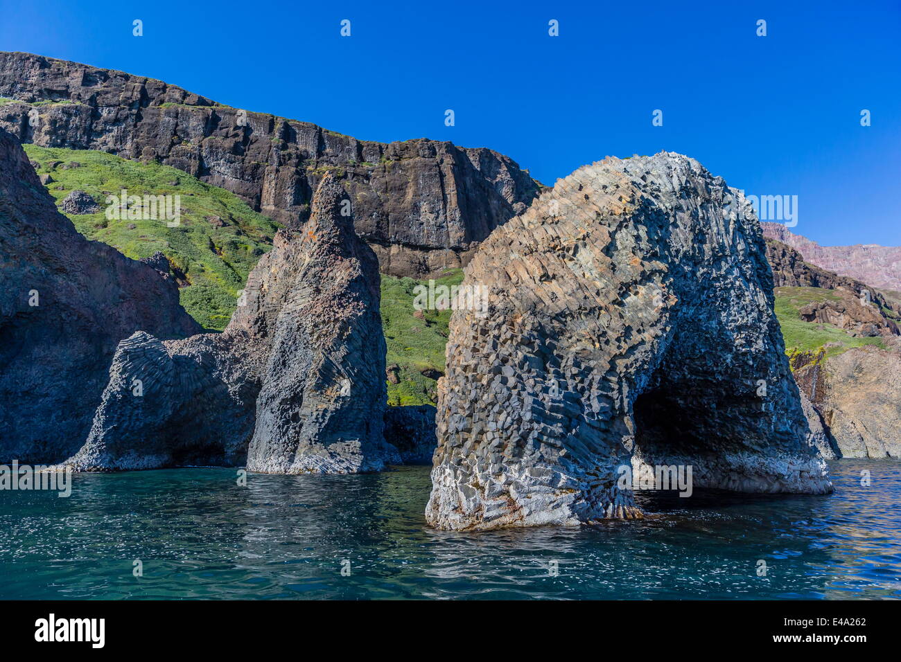 Arch of columnar basalt on the southern coast of Disko Island, Kuannersuit, Greenland, Polar Regions Stock Photo