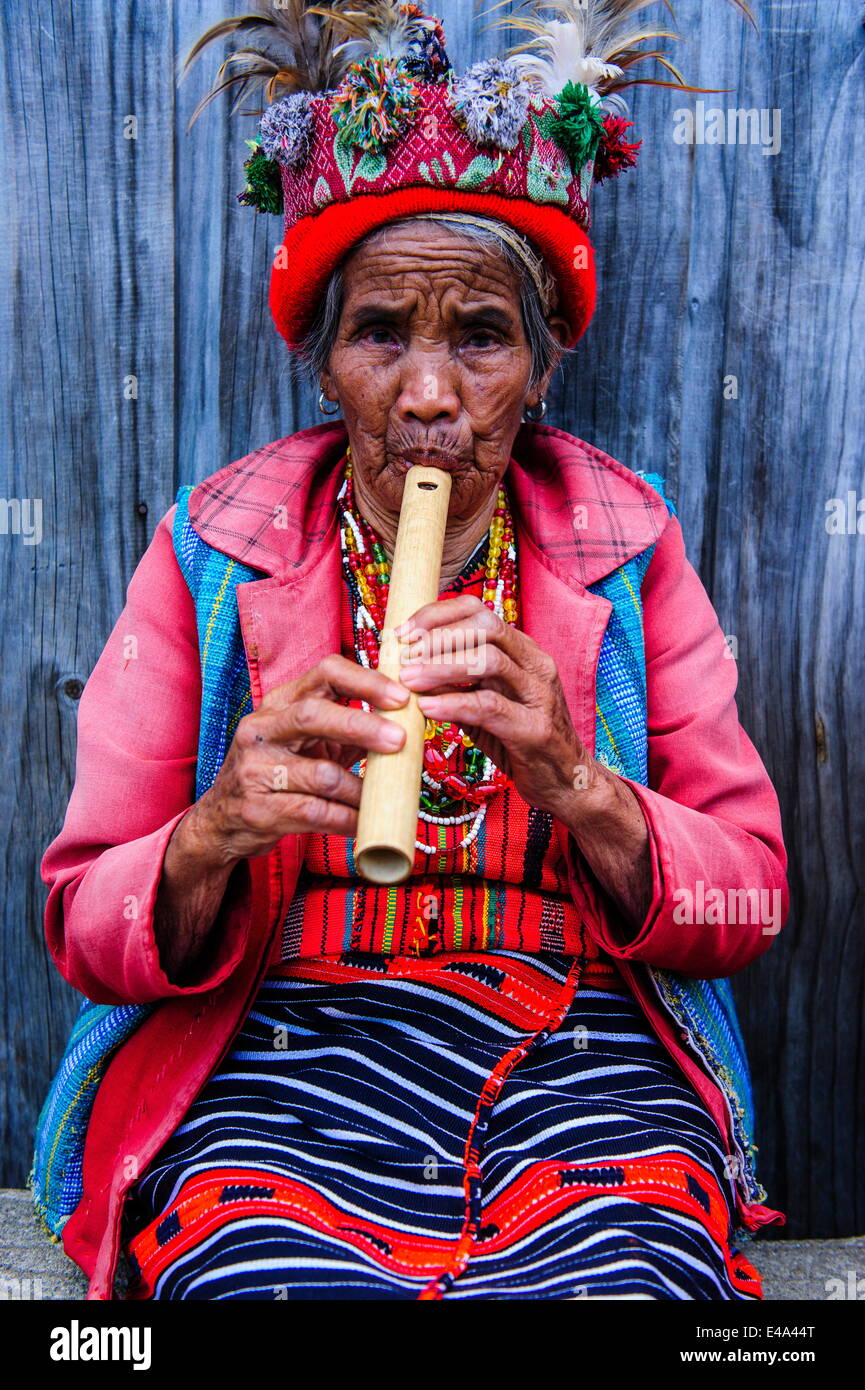 Traditional dressed Ifugao women playing the flute in Banaue, UNESCO, Northern Luzon, Philippines, Southeast Asia Stock Photo