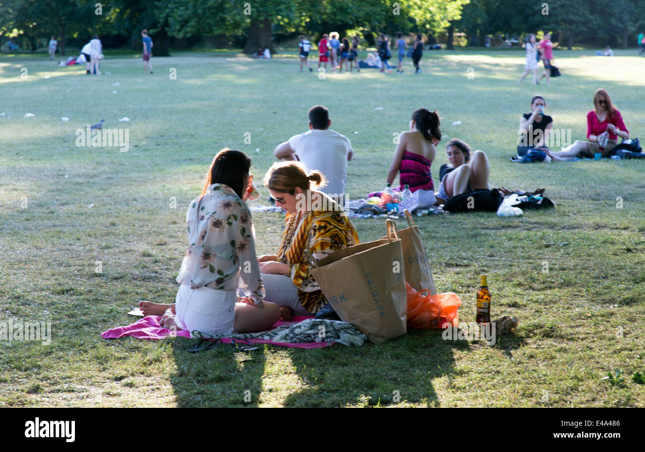 People On deck Chairs Hyde Park London UK Stock Photo