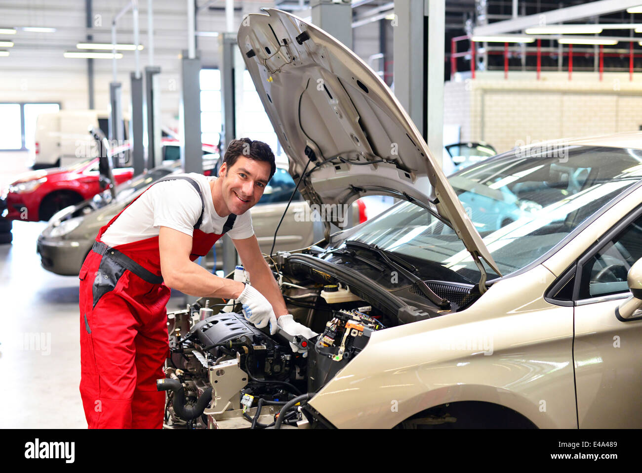 Car mechanic in a working at car Stock Photo Alamy