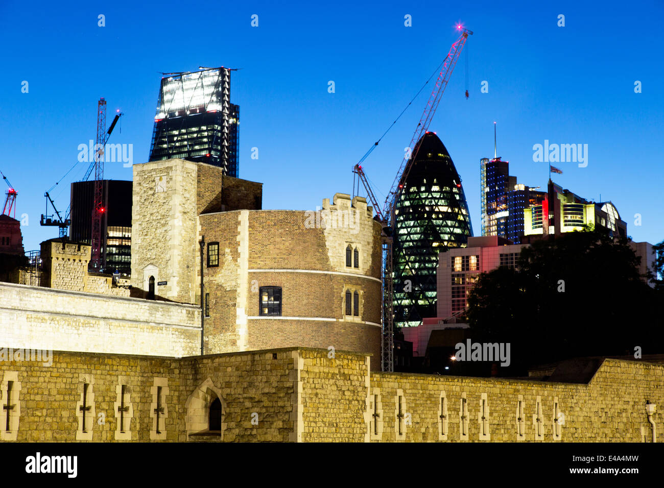 Tower Of London and City At Night London UK Stock Photo
