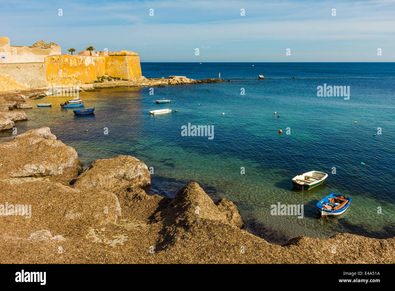 Cove and city walls seen from Via Mura Di Tramontana Ovest on sea front of this northwest fishing port, Trapani, Sicily, Italy Stock Photo