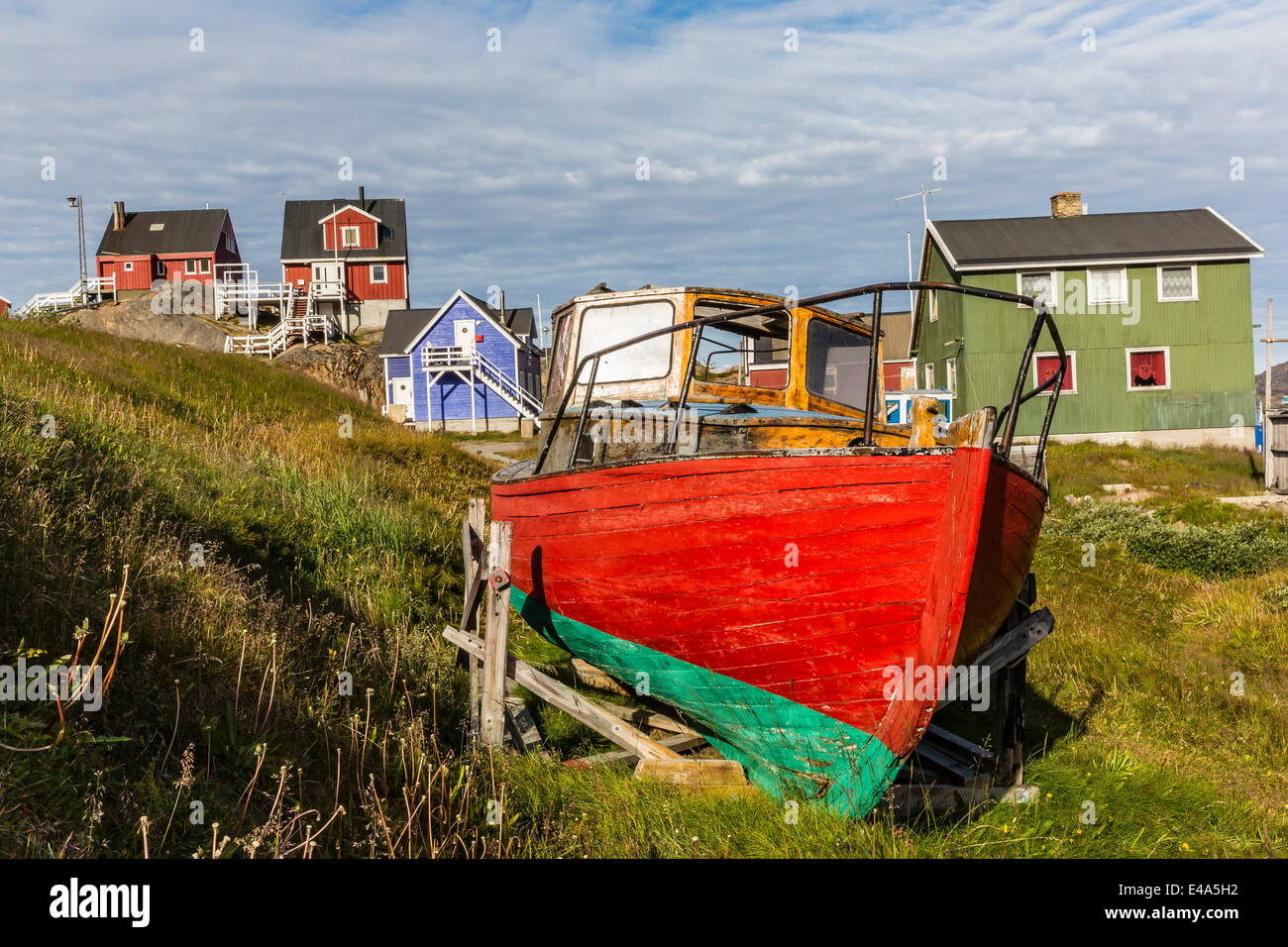 Brightly painted houses and boat in Sisimiut, Greenland, Polar Regions Stock Photo