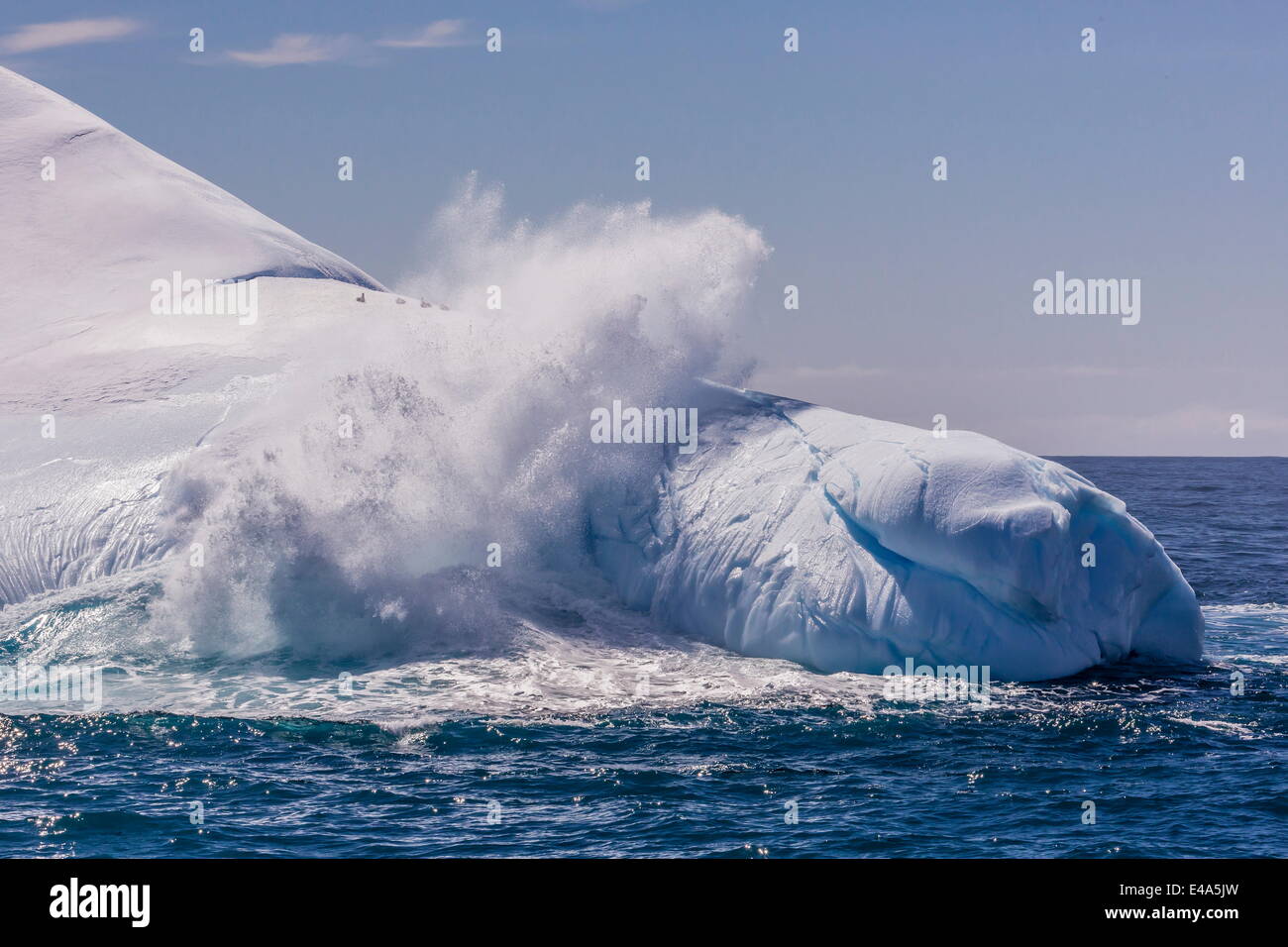 Waves washing over iceberg near Elephant Island, South Shetland Islands, Antarctica, Polar Regions Stock Photo