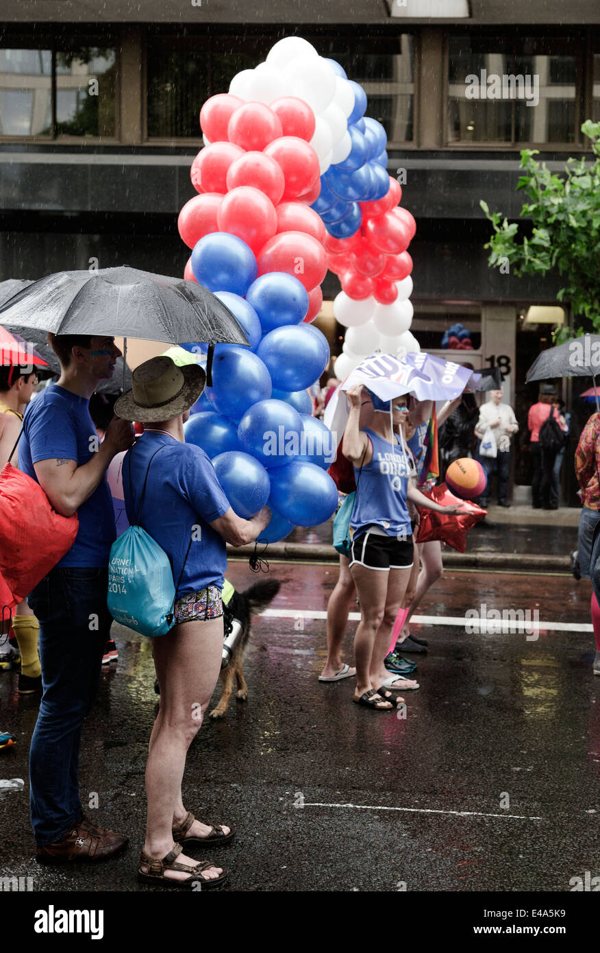 Torrential rain at start of procession. Pride London 2014, Baker Street, London, England, UK Stock Photo